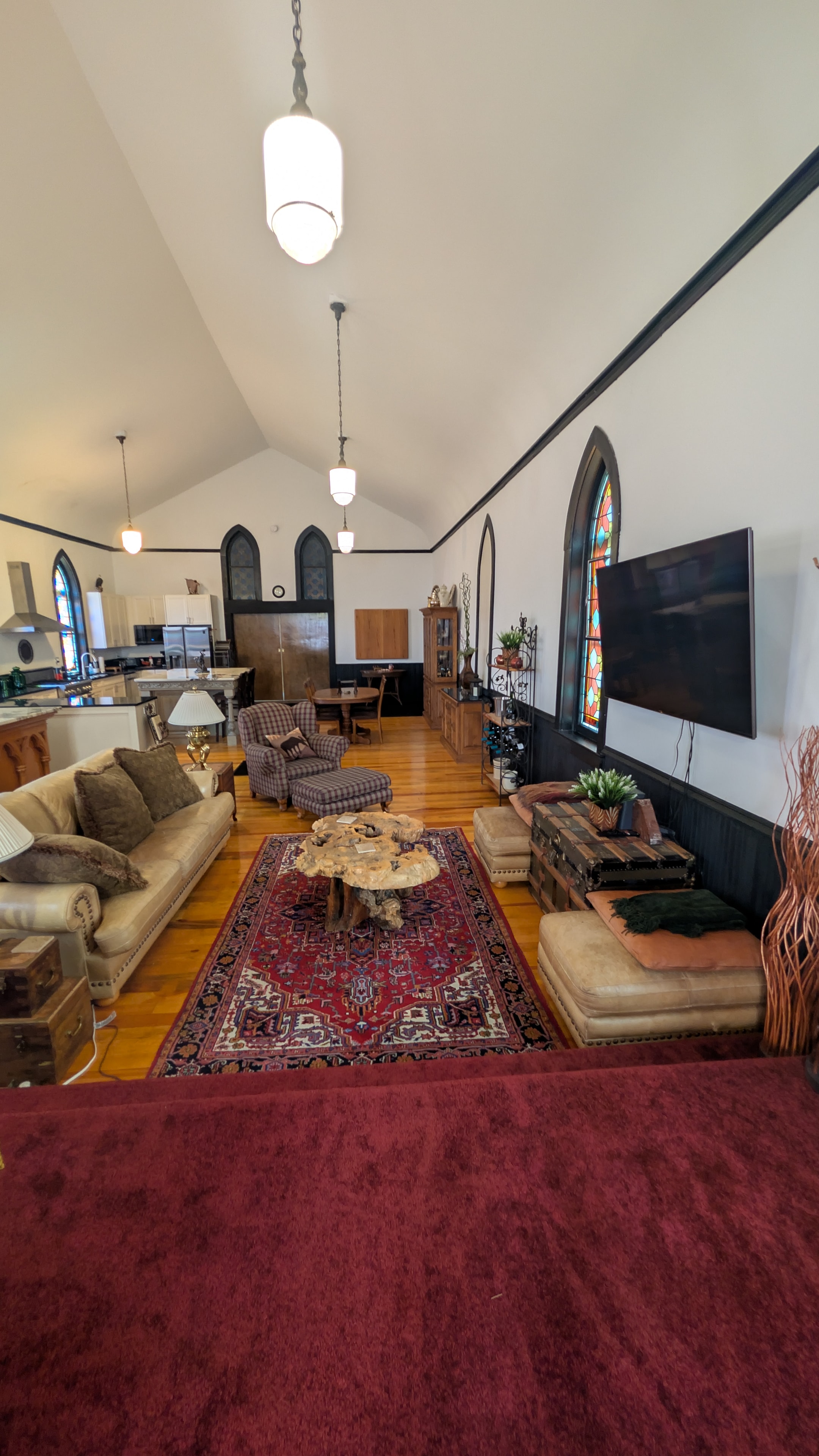 King master bedroom with four-poster bed and hardwood floors
