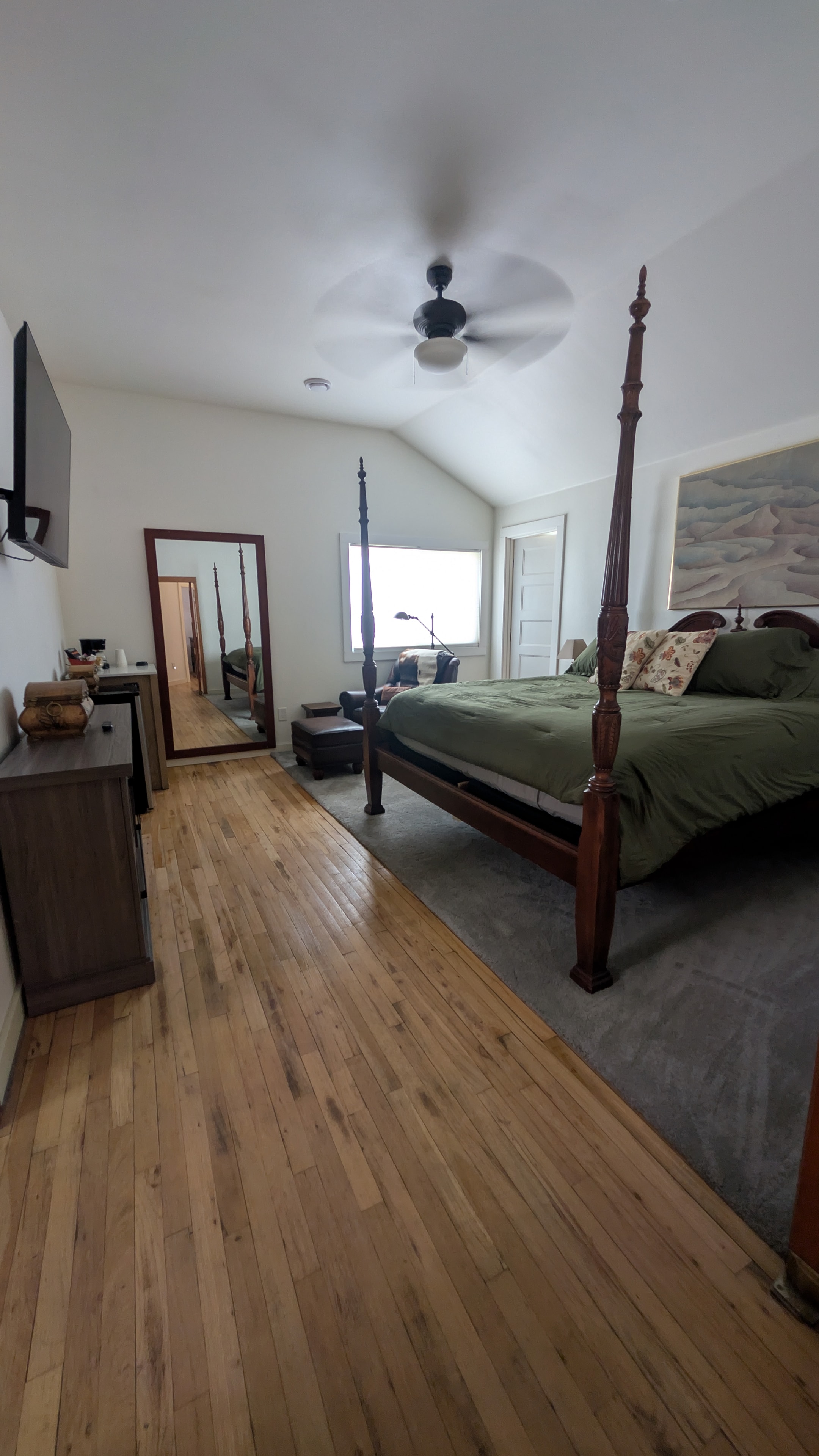 Chapel foyer hallway with stained glass and view into bedroom